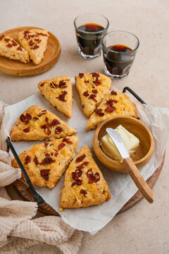 Overhead view of homemade savory bacon and cheese scones served on a
