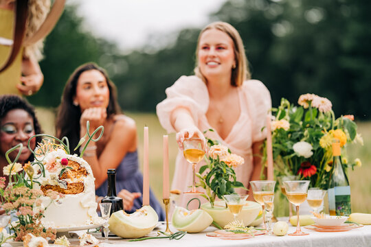 Stylish friends enjoying a beautiful outdoor party