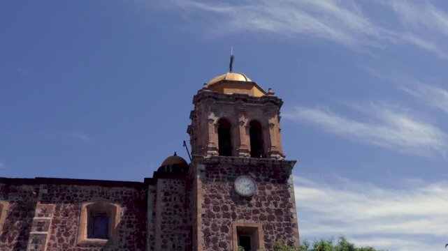 Parroquia Santiago Apostol in Tequila Jalisco with stone facade and bell tower
