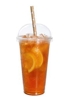 Refreshing iced tea with lemon slices and ice cubes in a plastic cup with a dome lid and polka dot straw, isolated on white