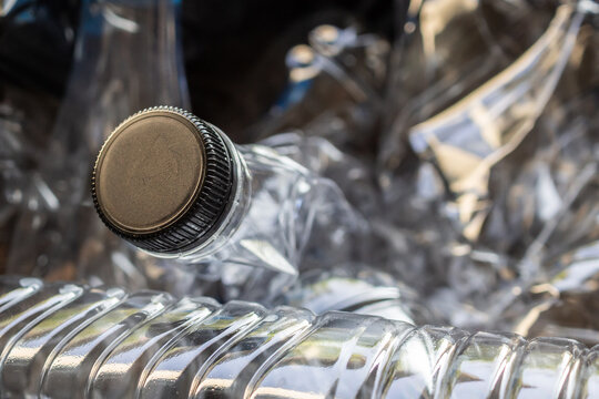 crushed plastic water bottles ready for recycling process, environmental pollution concept