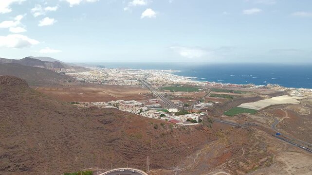 Aerial view of Adeje town, coastal landscape, and roads in Tenerife, Canary Islands