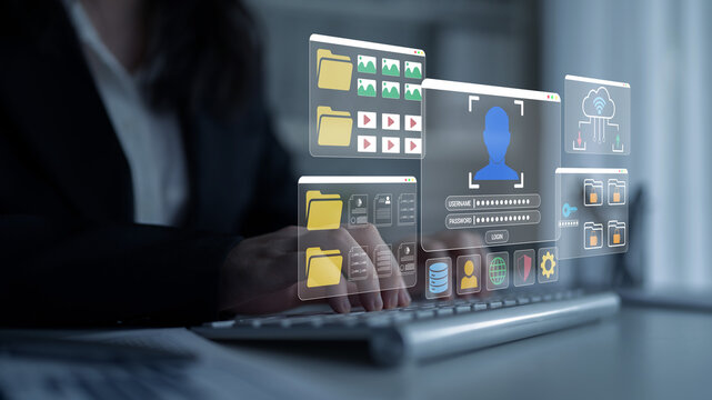Modern Businesswoman Engaging with Digital Interface Displaying Multimedia Content, Folders, and User Information in Office Environment Haptic.
