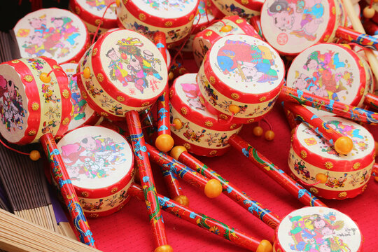 A large collection of colorful traditional Vietnamese hand drum toys called Trong Lac on a festive market display, Ho Chi Minh City, Vietnam.