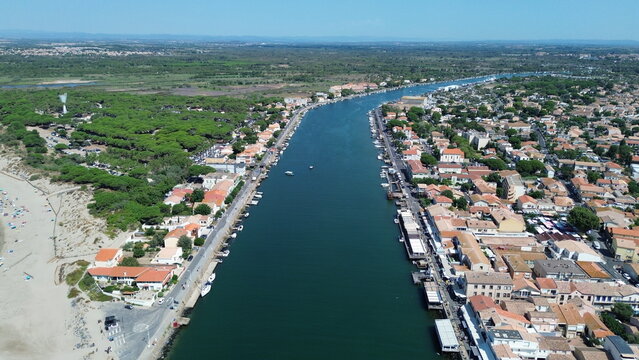 Aerial view of the Herault river mouth flowing into the Mediterranean Sea at Le Grau d'Agde, France