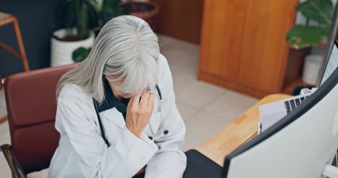 Woman, headache and doctor with fatigue in hospital for bad news or negative patient results. Migraine, stress and mature healthcare worker with burnout for mistake, error or medical fail in clinic.