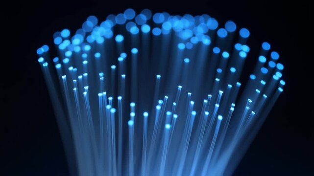 Glowing blue fiber optic strands with sparkling bokeh tips animation loop
