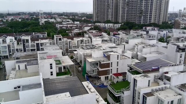 Boom Down Shot in the Rain of Houses and Landscape of Taguig in Metro Manila Philippines