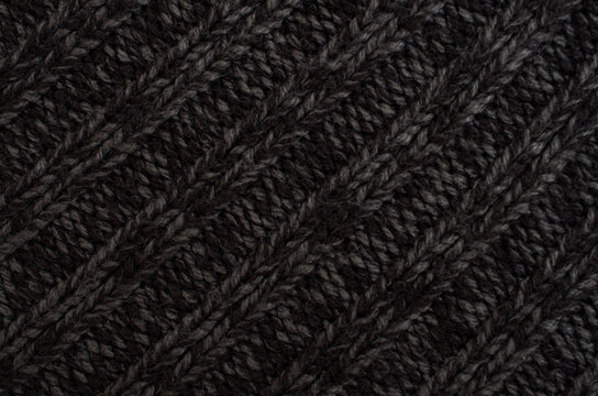 Dark Cable Knit Fabric Texture with Braided Wool Pattern and Detail