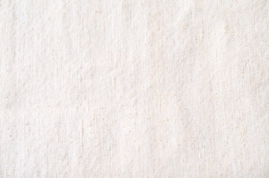 White Woven Fabric Texture with Fine Natural Fibers and Minimal Background