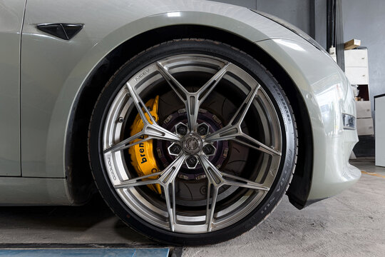 Hatyai, Thailand - Aug 24, 2026: Close up of aftermarket alloy wheel with Brembo brake caliper on car.
