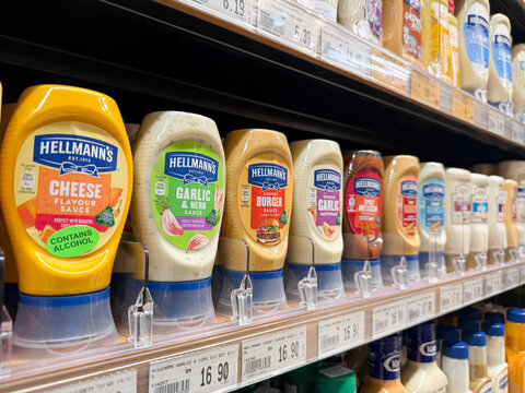 PENANG, MALAYSIA - AUG 18, 2026: Hellmann's mayonnaise and ranch sauces displayed on supermarket shelf.