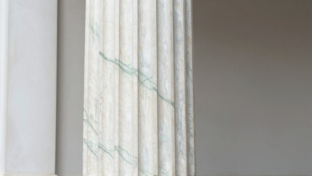 Close-up of veined marble pillars in ancient Greek and Roman architectural style