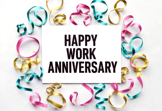 Happy work anniversary celebration with colorful ribbons and a white card message display