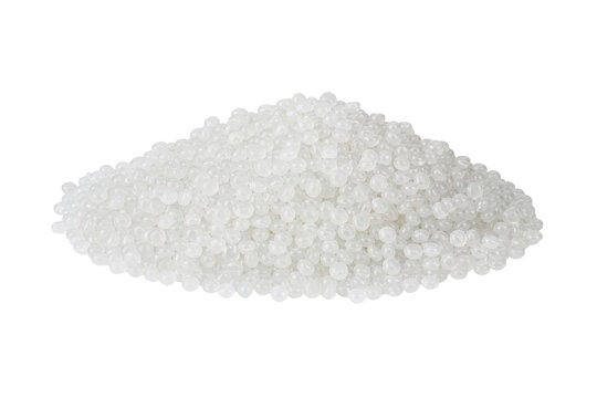 Large pile of white translucent plastic pellets forms a mound, isolated on a clean white background, showcasing industrial raw material