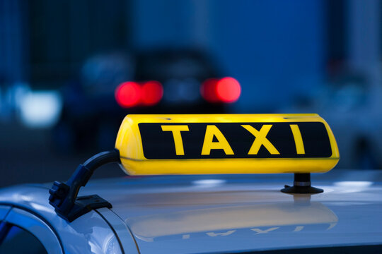 Germany, Bavaria, Munich, Roof of taxi and taxi sign