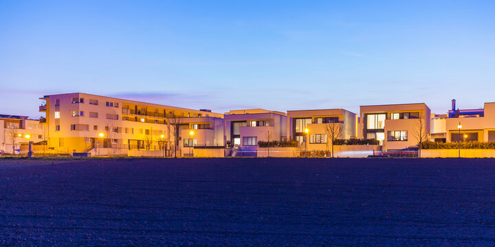 Germany, Ludwigsburg, development area, one-family houses and multi-family houses at dusk