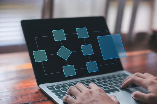 Business process workflow displayed on a laptop, illustrating task flow, system planning, project management, automation, and digital operations for modern technology teams.