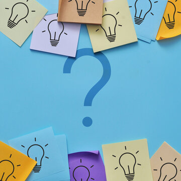 Large question mark surrounded by colorful educational symbols, representing curiosity, uncertainty, learning, and the search for answers.