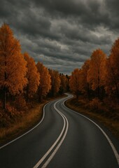 Naklejka premium Winding road through autumn forest