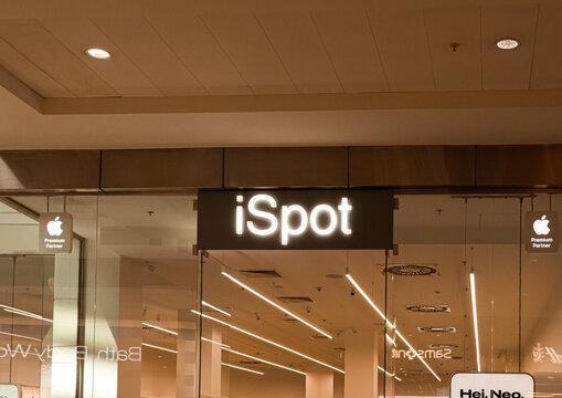 Warsaw, Poland, 20 August 2026. ISpot store sign with Apple Premium Partner logos in Arkadia shopping center, Warsaw