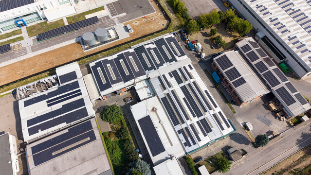 Aerial view of the Bercellesi Berinox S.R.L. industrial facility featuring extensive solar panel installations on the rooftops in Melegnano, Lombardia, Italy.