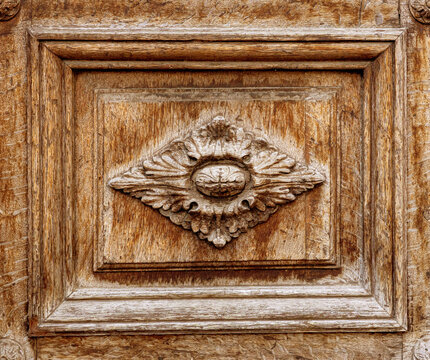 Decorative wood panel showing ornate floral carving
