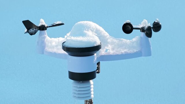 Wireless weather station on pole in snow. Sensors of temperature and humidity, Rain gauge and snow, Wind speed and direction. Climate monitoring, atmospheric research, Meteorological equipment. 4K.