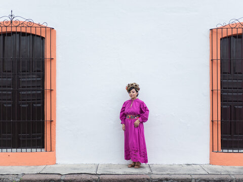 Mexican Woman in Traditional Dress Posing on a Street