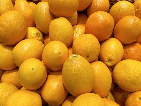 Fresh yellow lemons piled together, showcasing vibrant citrus fruit commonly used for cooking, beverages, desserts, and healthy nutrition.