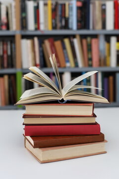 open book, books on the table