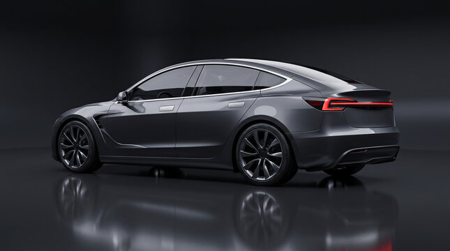 Sleek dark grey generic electric sedan shown from a rear angle in a dark studio setting