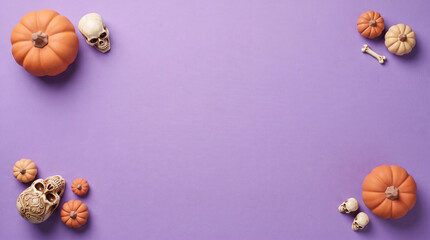 Fototapeta premium Pumpkins and human skulls are arranged on a lilac colored background creating a halloween themed composition autumnal bone calavera celebration cranium decay