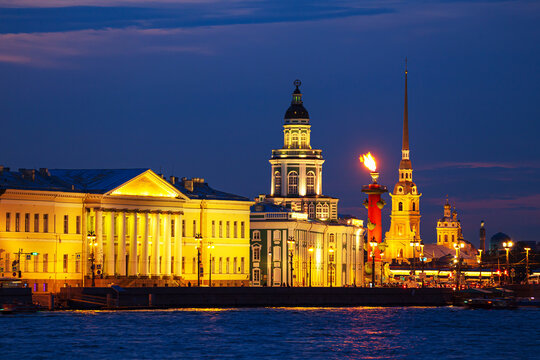 The Kunstkamera, the burning Rostral Columns and the Peter and Paul Cathedral.