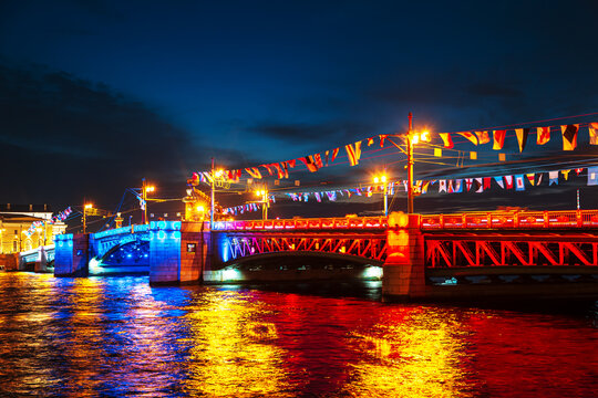 Palace Bridge in the colors of the Russian flag at night. Navy Day celebrations.