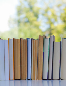 A simple composition of many hardback books. Going back to school. Education.
