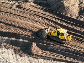 aerial view of a bulldozer for civil engineering work at a construction site, industrial, construction machine,  land use, foundation © keBu.Medien