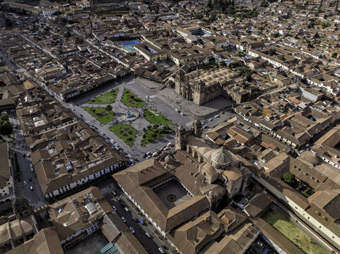 Aerial view of the historic Plaza de Armas in Old Town Cusco, featuring colonial architecture, red-tiled roofs, and the Cusco Cathedral, Cusco, Cuzco, Peru.