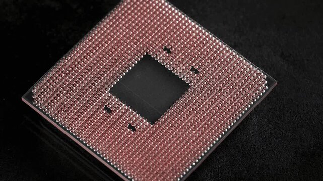 Detailed microchip architecture visible in a close-up studio shot of a modern CPU.