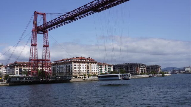 The gondola of the Vizcaya transporter bridge approaching the near bank.