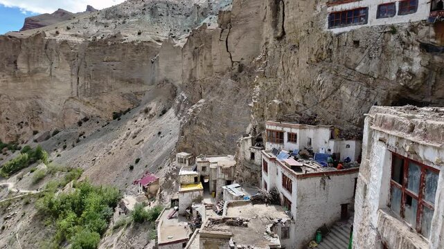 Phukthal, India : Panoramic footage of dramatic mountain, Tsarap river and valley with Phuktal gompa, cliffside tibetan buddhist monastery in Zanskar in Ladakh, India. Shot as a time wrap.