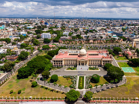 Aerial view of the Palacio Nacional with its neoclassical architecture and dome surrounded by lush gardens and the urban landscape of Santo Domingo, Distrito Nacional, Dominican Republic.
