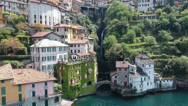 Nesso, Lake Como, Italy, drone view of Orrido waterfall, Ponte della Civera and village homes