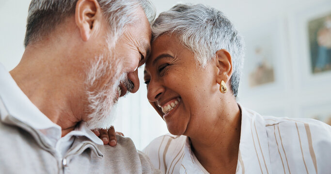Senior, couple and happy in home with love, funny conversation and connection in relationship. Laughing, people and affection in retirement with forehead touch, healthy marriage or bonding with chat