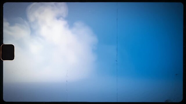 White cloud of smoke in blue film frame