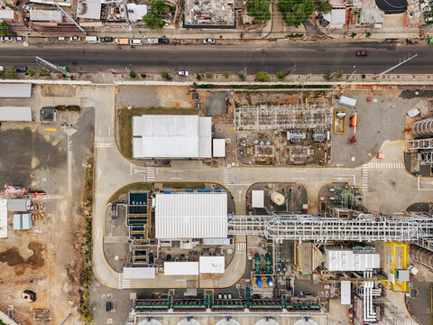 Aerial view of Parque Electrico Los Mina power plant with industrial buildings, electrical infrastructure, and access roads, Santo Domingo, Santo Domingo, Dominican Republic.