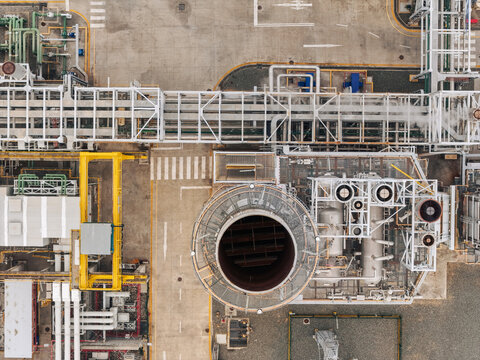 Aerial view of Parque Electrico Los Mina power plant featuring industrial pipes, cooling towers, and infrastructure in Santo Domingo, Santo Domingo, Dominican Republic.