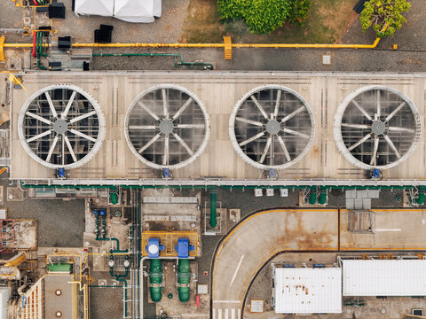 Aerial view of the large industrial cooling fans at Parque Electrico Los Mina with complex piping and infrastructure in Santo Domingo, Santo Domingo, Dominican Republic.