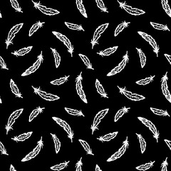 Naklejka premium Hand-drawn grunge white fineliner seamless pattern of flying raven feathers on black background for gothic textiles, dark fantasy apparel, witchy stationery, horror wrapping paper, mystical home decor