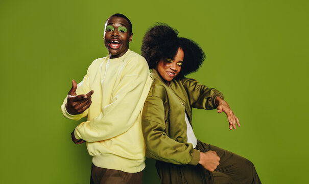 Energy fills the studio as friends dance together with playful urban style
